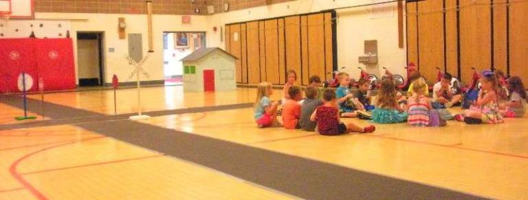 Incoming kindergartners enjoy a snack inside &quot;Safety Town.&quot;