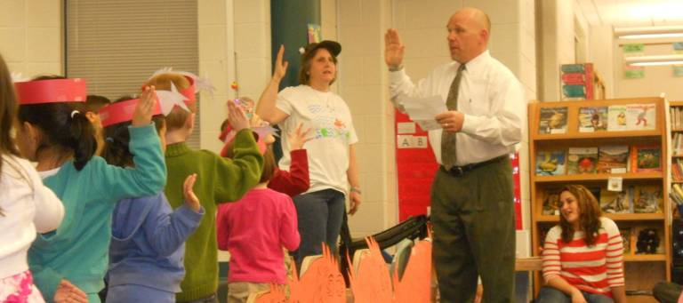 For the Love of Reading Mayor James Oscovitch administers an oath to the students of Byram Lakes School to become life-long readers.