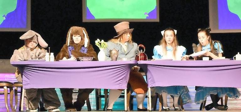 At the tea party with the March Hare (Camryn Ricard), the Dormouse (Sofia Bodnar), and the Mad Hatter (Sarah Inglima).(Photo provided)