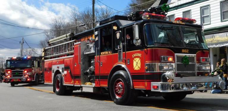 Newton Fire Department Engine 802 rolls down Spring Street during the 2019 St. Patrick's Day parade. The department will sponsor this year's parade, which begins at 11 a.m. on Saturday, March 21, 2020.