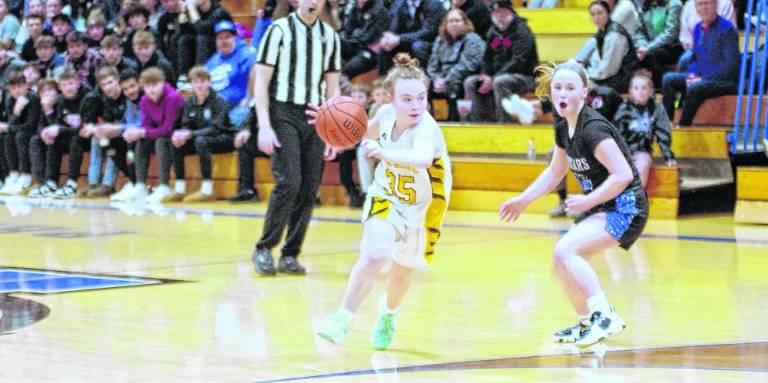 A Cedar Grove Panther dribbles the ball past a Kittatinny Cougar.