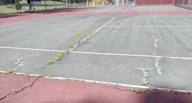 Merriam tennis court is playable once again The Merriam tennis court before repairs (Mary Rapuano)