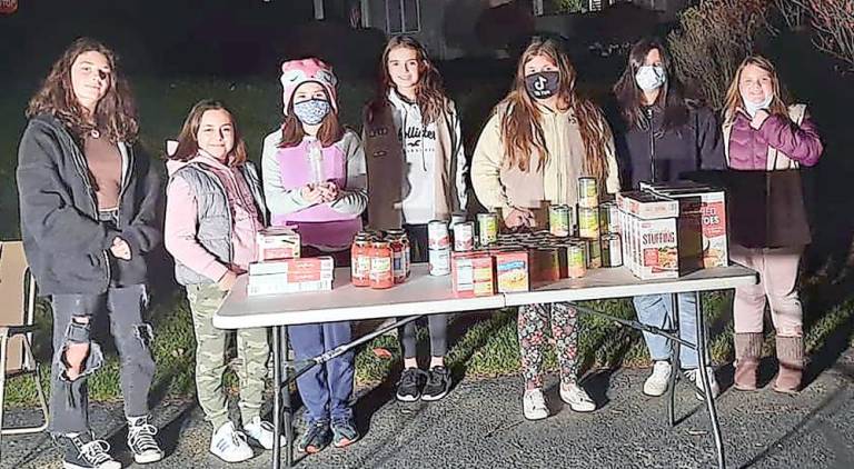 Wallkill Valley Girl Scouts donate Thanksgiving dinners to food pantry The Wallkill Valley Girl Scouts donated seven complete dinner bags and 12 turkeys (Photo provided)