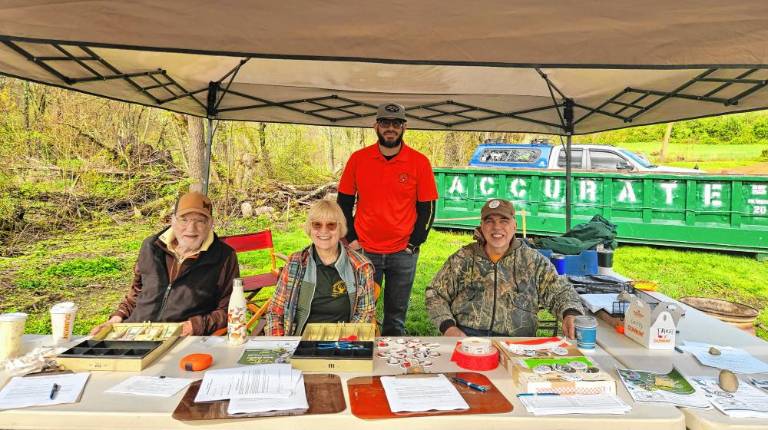 30th annual Traditional Bow Shoot John Bottone, Holly Hillman, Rich Valenzuela and Frank Nagy register people for the event.