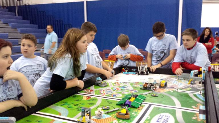 Middle school students test hydro dynamics at robotics competition Team #4103 ‘Hydrodragons’ from Halsted Middle School test their robot together before matches begin Photo courtesy of Jim Hofmann