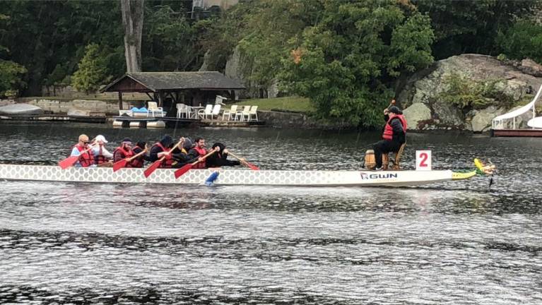 The drummer helps to keep the rowers synchronized.