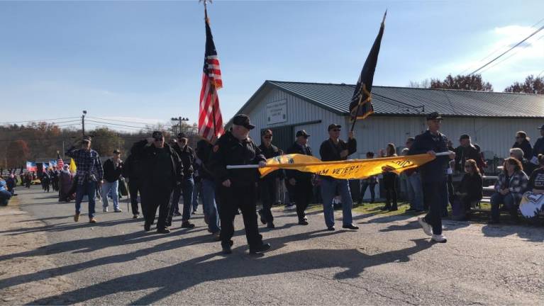 Veterans honored with parade, ceremony Vietnam veterans march in the 23rd annual Salute to Military Veterans on Sunday, Nov. 5 at the Sussex County Fairgrounds. (Photo by Kathy Shwiff)