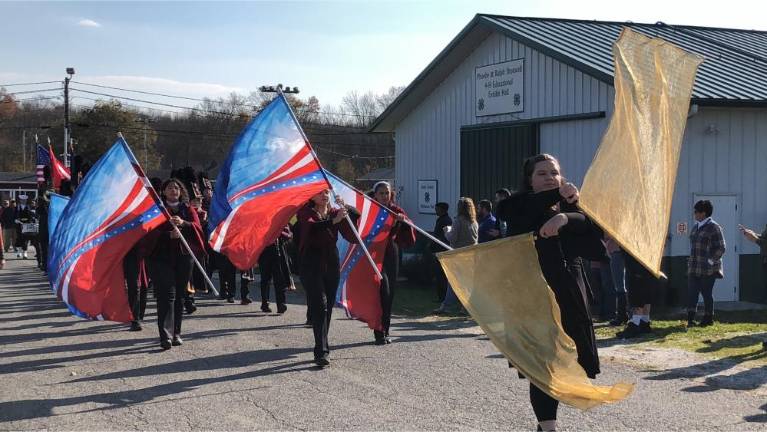 Veterans honored with parade, ceremony Members of the Color Guard precede the Newton High School marching band.