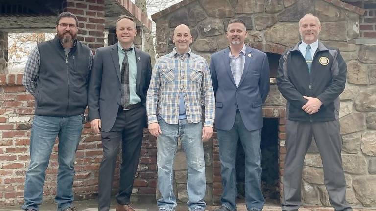 Three retiring police chiefs give back to the community Pictured (from left): Ret. Chief Mike Richards of Newton; Chief Neil Spidaletto of Sparta; Steve Scro, owner of the Mohawk House; Ret. Chief Brett Alemy of Hardyston, and Ret. Chief Pete Zabita of Byram (Photo by Amy Lynne)