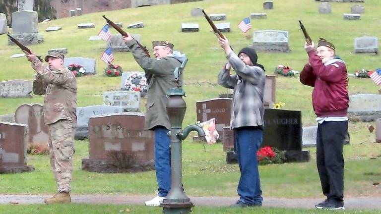 Veterans were honored with a three-shot volley (Photo by Janet Redyke)
