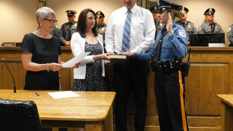 First officer who's a woman is sworn in, and two officers receive promotions First officer who's a woman is sworn in, and two officers receive promotions