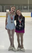 Harper Schmid, left, and Paige Parlapiano trained six days a week before the competition.