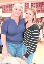 Jullie Willis and Nicole Malcolm, both of Green Township, pose for a photo.