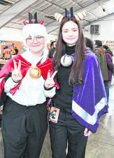 <b>Teryn Hardy of Sussex and Leah Bischooff of Branchville cosplay as characters from Cult of the Lamb.</b>