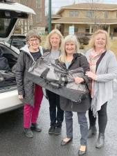 Newton Rotary Club members Laura Camp, Alice Vigiletti, Denise Current, and Kathie Shankman delivered duffel bags brimming with essential supplies for children and adults to Project Self-Sufficiency.