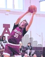 Newton's Anthony Romeo grabs the ball in the second period. Romeo scored 3 points.