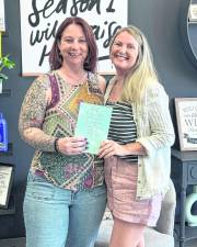 Pictured, from left, are Heather Olla, a stylist at Devine Designs, and author Everly Lane celebrating the release of <i>Be Still and Know: A 31-Day Guide to Manifesting God’s Blessings</i>.