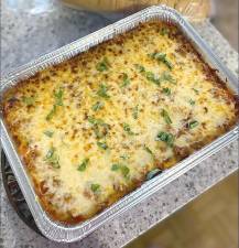 A fresh, home-cooked lasagna ready to be delivered.