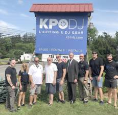 The KPODJ staff celebrates the company’s new location.