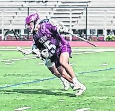 Newton's Evan Cotter (25) is on the move with the ball. Cotter scooped up 5 ground balls (GB) and scored 1 goal.