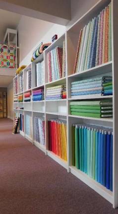 A rainbow of colorful fabrics greets customers.