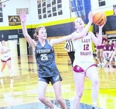 Newton's Avery Eigner leaps during a shot. Eigner scored 16 points.
