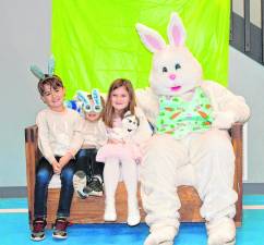 Clay and Sawyer Sucameli and Aspen Miller pose with the Easter Bunny at Hampton Township Fire &amp; Rescue’s pancake breakfast Sunday, March 10. (Photo by Maria Kovic)