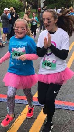 Girls on the Run Spring season is quickly approaching and resgistration is open. Pictured here are Abby Siipola and her running buddy Michaela Bleakley at the 2018 5K. (Photo provided).