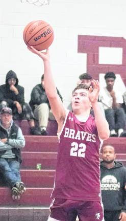 Newton's Bode Lombardo in the midst of a shot in the second period. Lombardo scored 7 points.