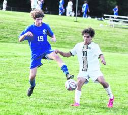 Kittatinny's Nathan Itnyre (15) and Sussex Tech's Cayle Marino (10) battle for control of the ball.