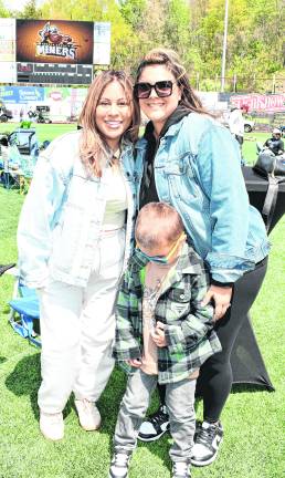 <b>Jaime Buck of Andover, Kim Idiaquez and Stephen Topchev of Bridgewater pose for a photo.</b>