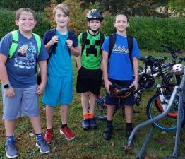 (Left to right): Noah DeKnight, Jake Palermo, Aaron Cahill and Matthew Rowan are all smiles as they arrive at Valley Road School on foot and on two wheels