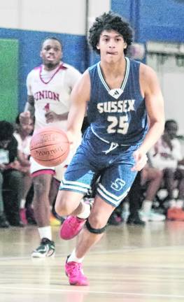 <b>Sussex County's J.J. Olivo dribbles the ball.</b>