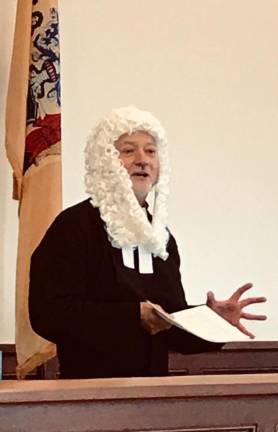 Father Griner regales the congregation with historic facts at the Sussex County Courthouse on Sunday, Nov. 3, 2019.