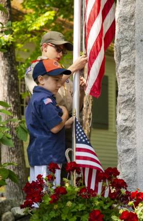 Luke Allen, 8, of Cub Scouts Pack 276 and Jacob Schnetzer, 13, of Boy Scout Troop 276 prepare to raise the flag at the Memorial Day ceremony Monday, May 29 at Roseville School in Byram. (Photos by John Hester)