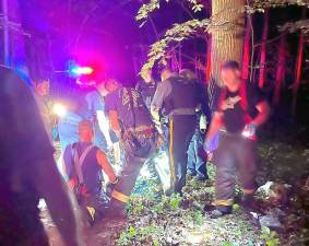 A team of first responders helped carry the rider out of the woods.
