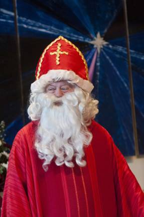 Saint Nicholas speaks at mass on Sunday.