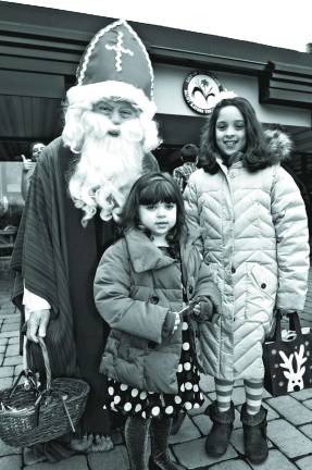 Saint Nicholas with Isabel Roberts, 4, of Hopatcong and sister Sophia, 8.