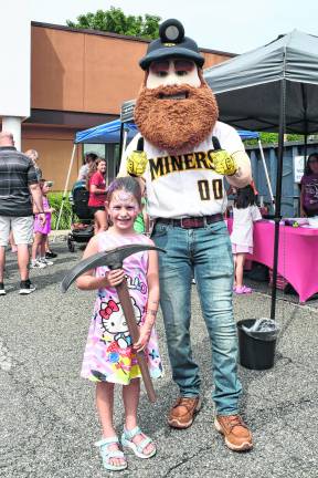 Audrey Schoonover of Hampton poses with Sussex County Miners' mascot, Herbie.