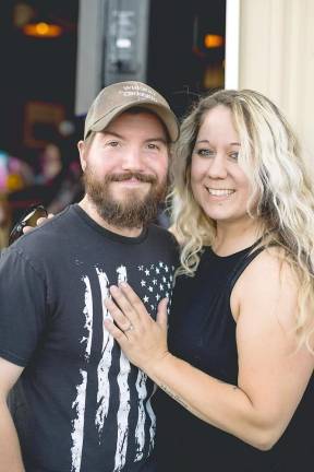 Andrew Gallagher and Tina Ahlers rejoice in their engagement.