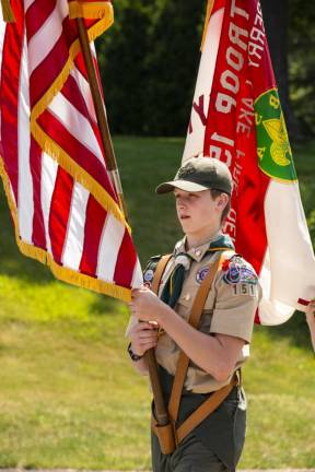 A member of Boy Scout Troop 151 in Cranberry Lake marches in the parade.