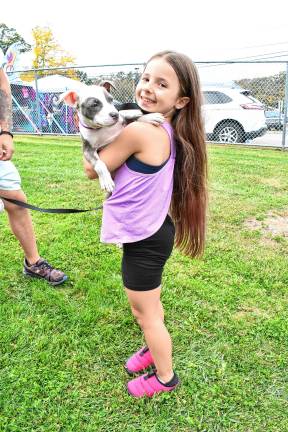 Tessa Toale with Lovey, a dog available for adoption.