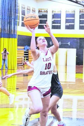 Newton's Brielle Roberts (10) in the midst of a shot in the third period.