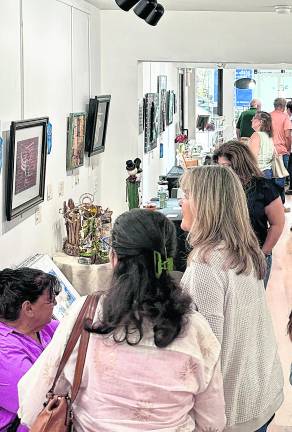 <b>Visitors enjoy the opening reception for the 2026 Sussex County Senior Citizens Art Exhibition at Sussex County Arts &amp; Heritage Council in Newton. The annual exhibition showcases artwork by Sussex County residents age 60 and over and is on view through October 1.</b>