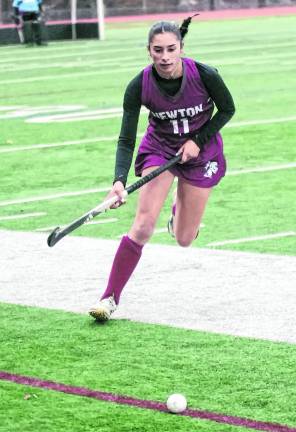 Newton's Christina Roque moves towards the ball.