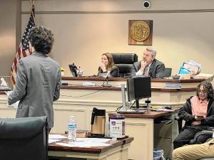 Sussex County Bar Association president Brent Rafuse and secretary Vanessa Henderson judge a preliminary round of the Sussex County High School Mock Trial Competition. (Photos by Travis Nunziato)