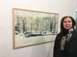 Doris Ettlinger with one of her paintings