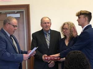 New Sussex County Commissioner Jack DeGroot, right, of Wantage is sworn in Monday, Jan. 1 as his parents, George and Katherine DeGroot, watch. Assemblyman Parker Space, left, administered the oath of office in the county courthouse. (Photo by Kathy Shwiff)