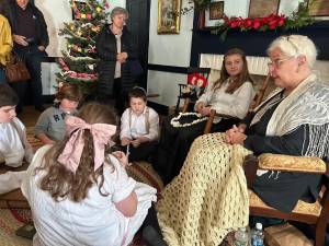 Gail Shawger with her ‘grandchildren’ Madeline Kinney, Isabel Fernandes, Miles Swanson, Heath Ziccardi and Eric Fernandes show what Christmas was like in 1916. (Photos by Daniele Sciuto)