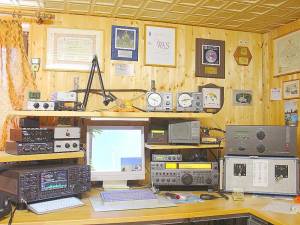 An example of an amateur radio station with four transceivers, amplifiers, and a computer for logging and for digital modes.